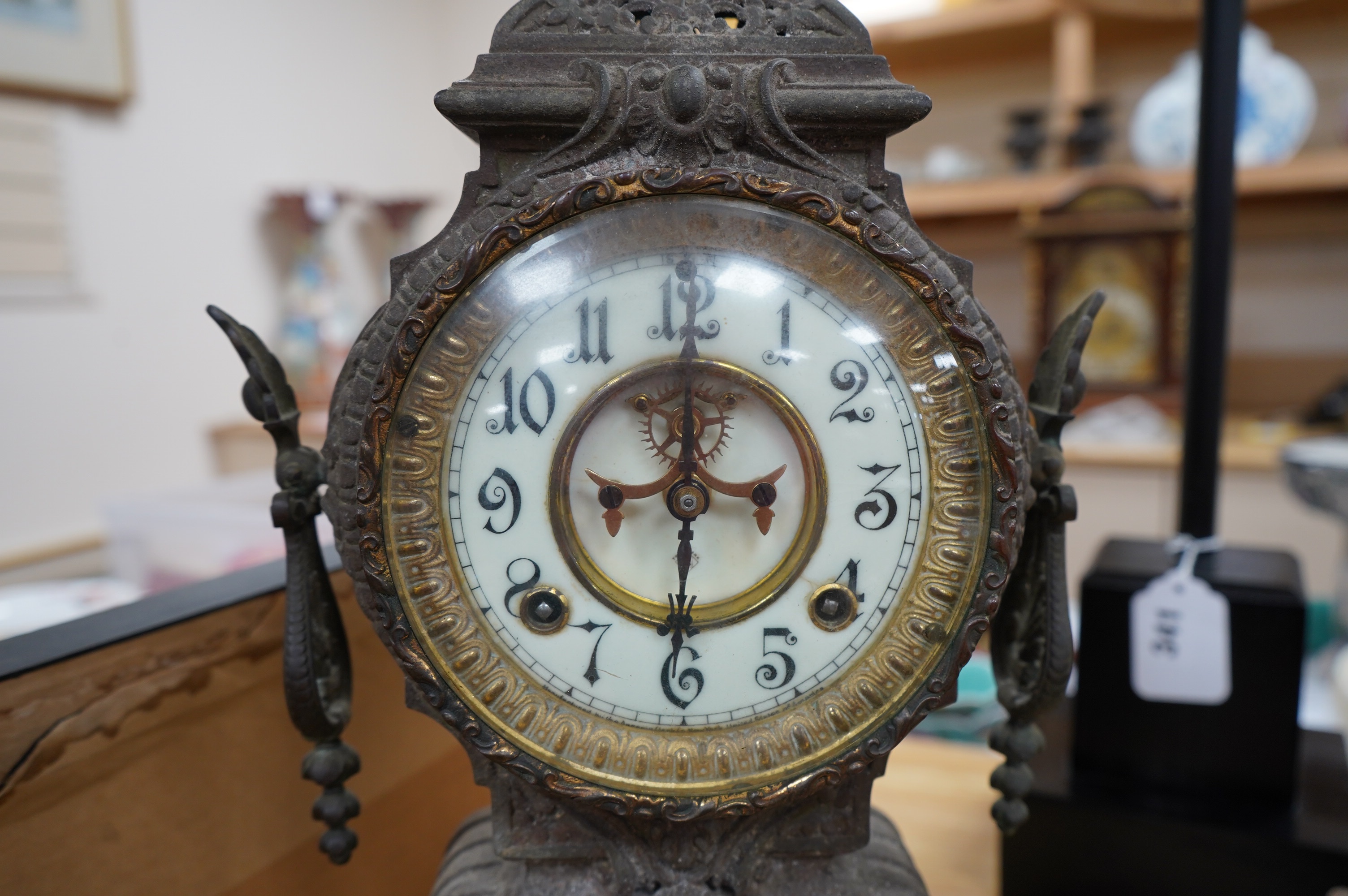 A spelter clock with enamel Arabic dial, 47cm high. Condition - poor to fair, untested